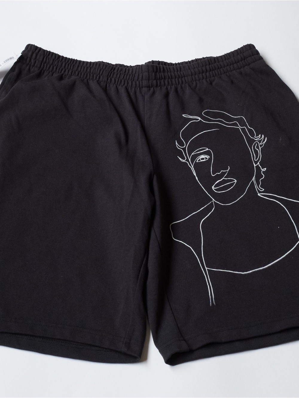 TNA Black Shorts with White Line Art Face Graphic